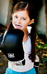 little girl with boxing gloves